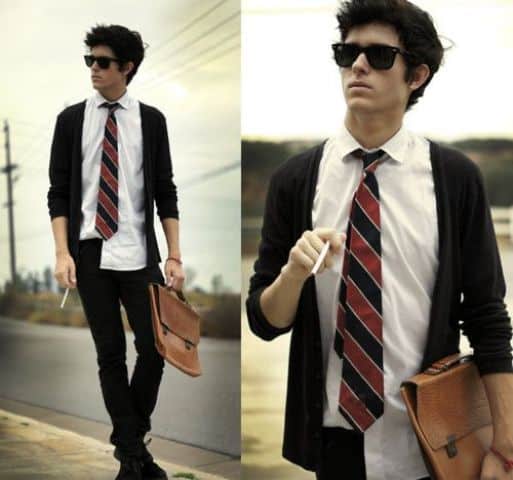 black jeans, a white shirt, a striped tie and a black cardigan